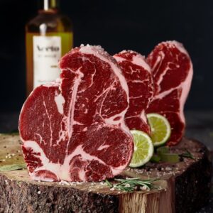 raw meat on brown wooden chopping board